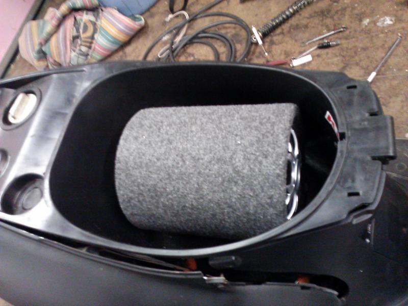 Had to trim the access  panel for the carburetor so my subwoofer would fit in my trunk