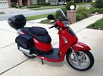 Kymco People S200 
Hit the button and roll. She's a rock.
